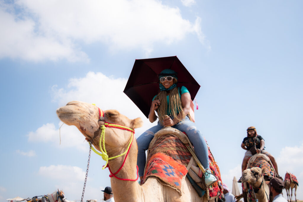 lady siting on a camel in Egypt